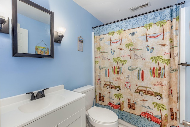 full bathroom with visible vents, toilet, vanity, and shower / tub combo with curtain