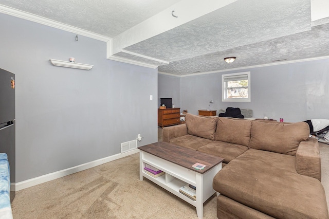 living area with visible vents, crown molding, baseboards, carpet, and a textured ceiling