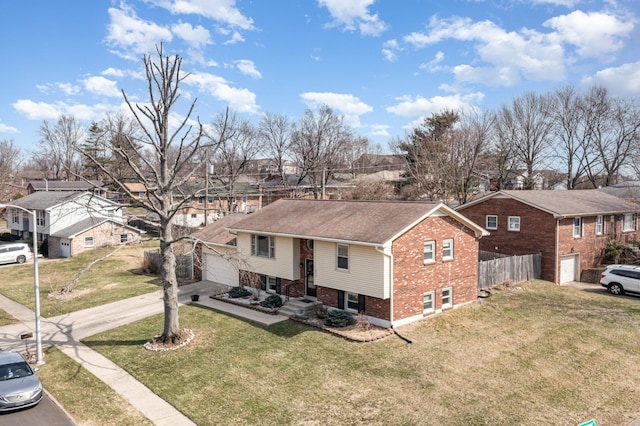 view of front of property featuring fence, a garage, brick siding, and a residential view