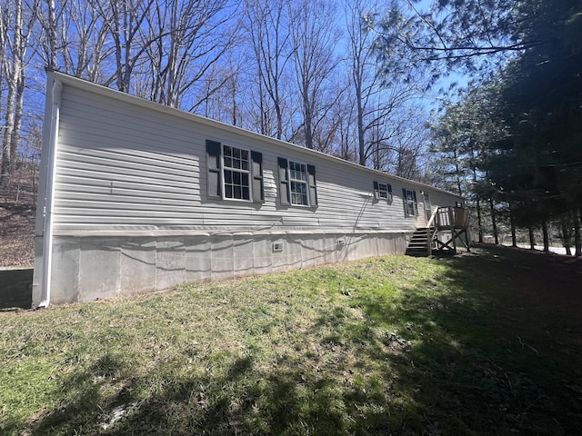 view of property exterior with a yard