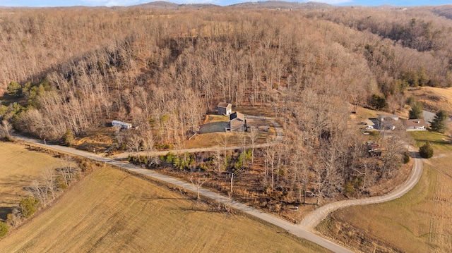 bird's eye view featuring a wooded view