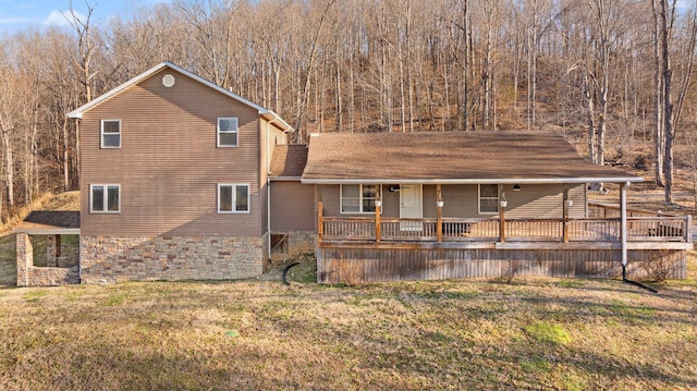 exterior space with a porch and a front lawn