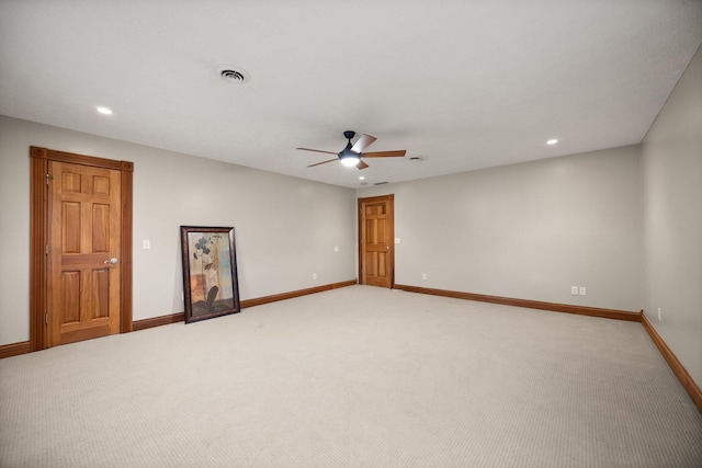 empty room featuring recessed lighting, baseboards, light colored carpet, and ceiling fan