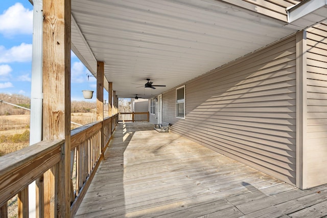 wooden deck with a ceiling fan