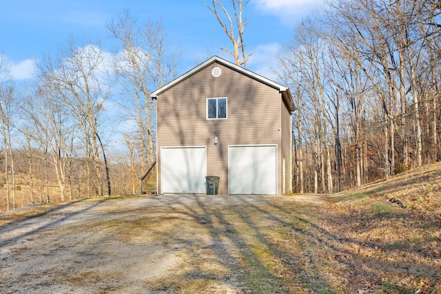 exterior space with an attached garage and driveway