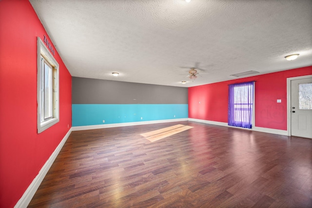1343 Bastin Creek Rd, Kings Mountain, KY 40442 - interior space featuring wood finished floors, a textured ceiling, ceiling fan, baseboards, and visible vents