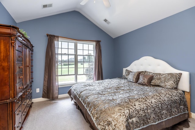 bedroom with light carpet, baseboards, visible vents, and vaulted ceiling