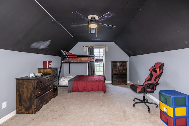 bedroom featuring carpet, baseboards, and vaulted ceiling