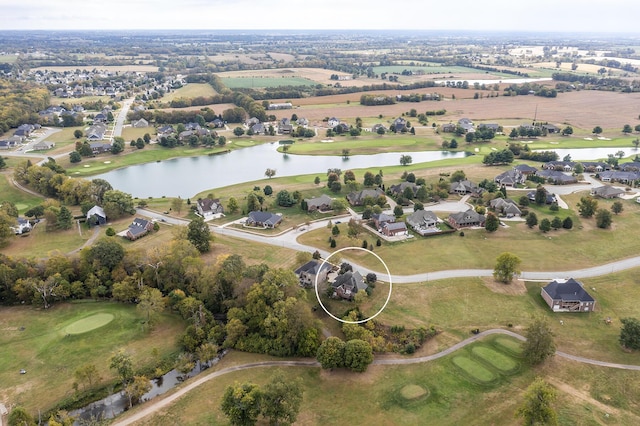 drone / aerial view featuring a water view and a residential view