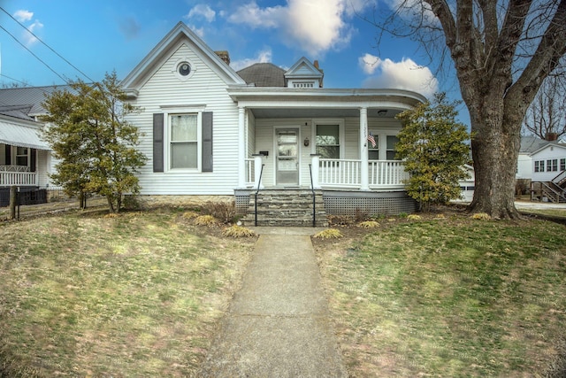 view of front facade with a porch and a front yard