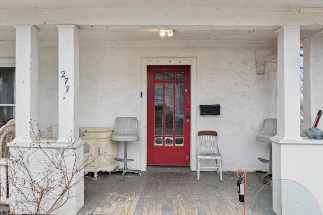 property entrance featuring stucco siding