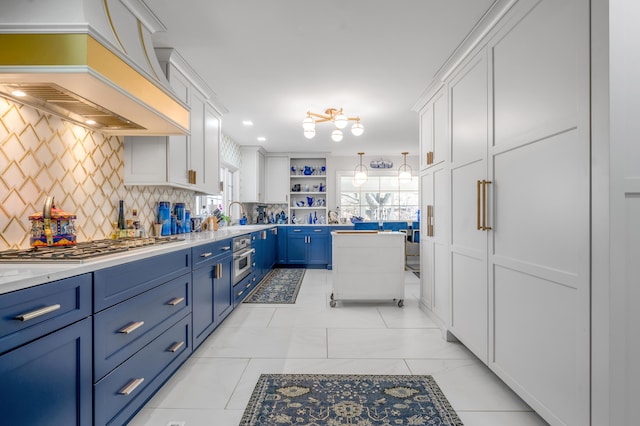 kitchen featuring blue cabinetry, open shelves, stainless steel appliances, custom range hood, and white cabinets