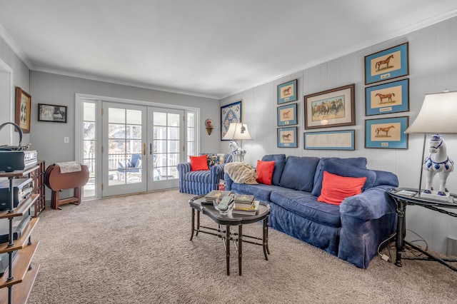 living area featuring carpet, french doors, and crown molding