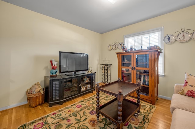 living room with wood finished floors and baseboards