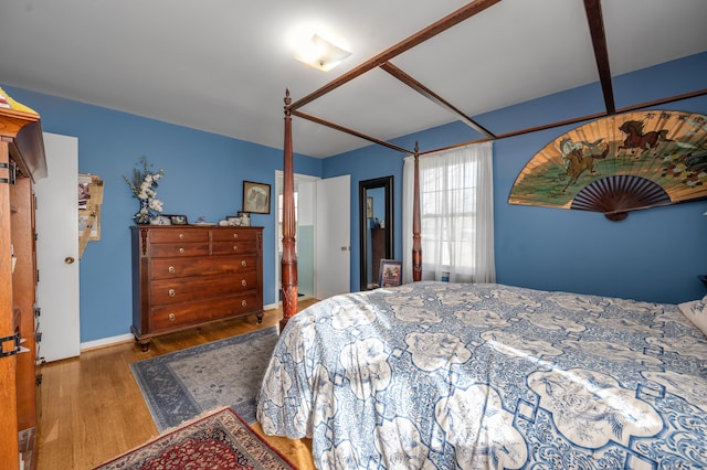 bedroom with wood finished floors