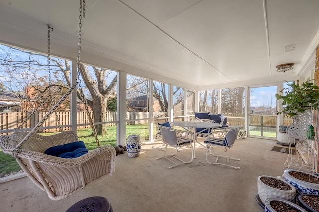 unfurnished sunroom with visible vents