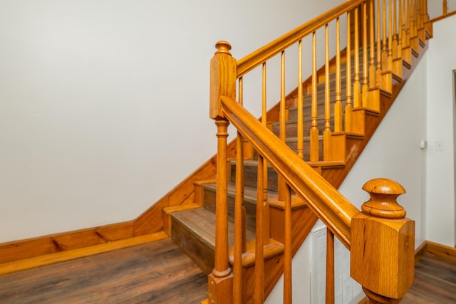 staircase featuring wood finished floors