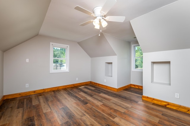 additional living space with ceiling fan, baseboards, vaulted ceiling, and wood finished floors