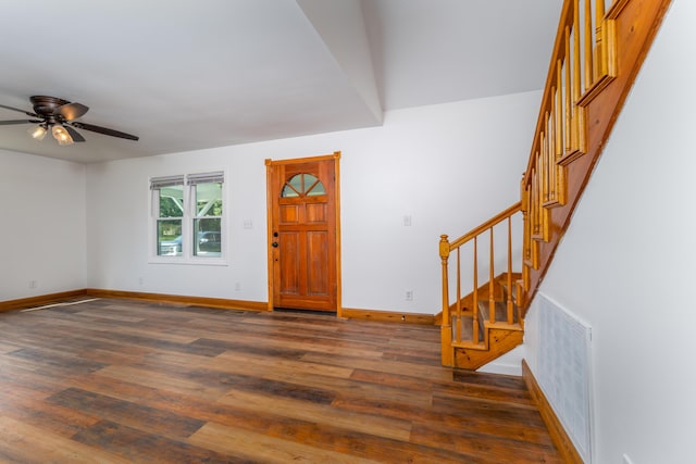 entrance foyer featuring baseboards, stairs, visible vents, and dark wood finished floors