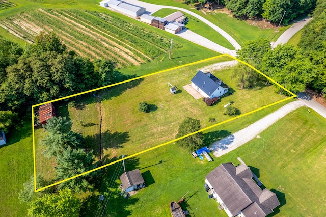 birds eye view of property with a rural view