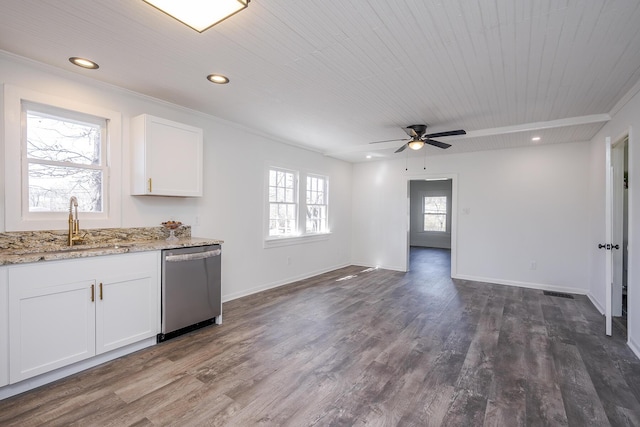 kitchen with white cabinets, dark wood finished floors, stainless steel dishwasher, and recessed lighting