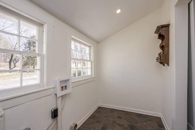 washroom with washer hookup, laundry area, a healthy amount of sunlight, and baseboards