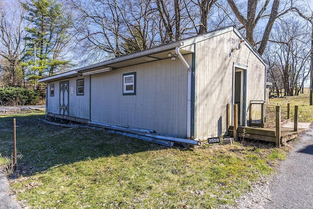 view of side of property with a yard