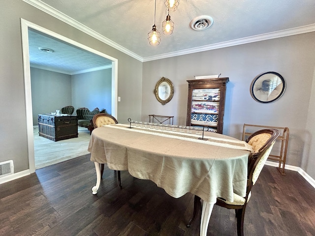 playroom with ornamental molding, dark wood finished floors, visible vents, and baseboards