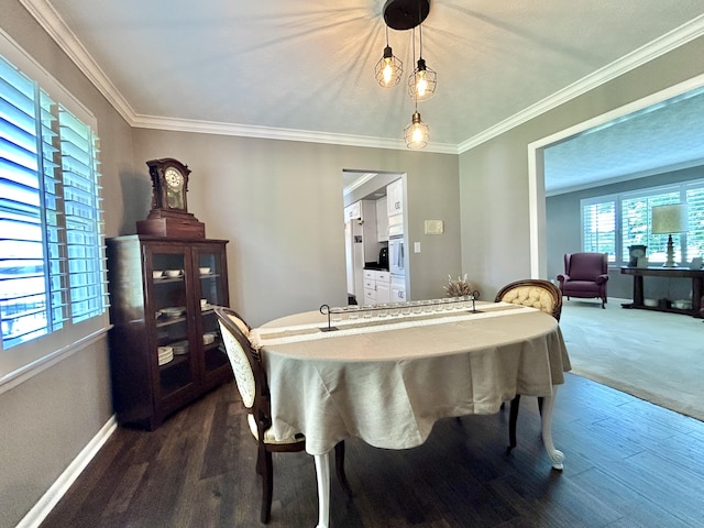 dining room with baseboards, ornamental molding, and dark wood-type flooring