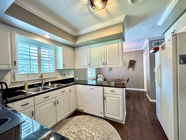 kitchen featuring ornamental molding, white appliances, a sink, and white cabinetry