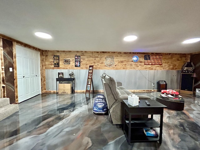 living area with concrete floors