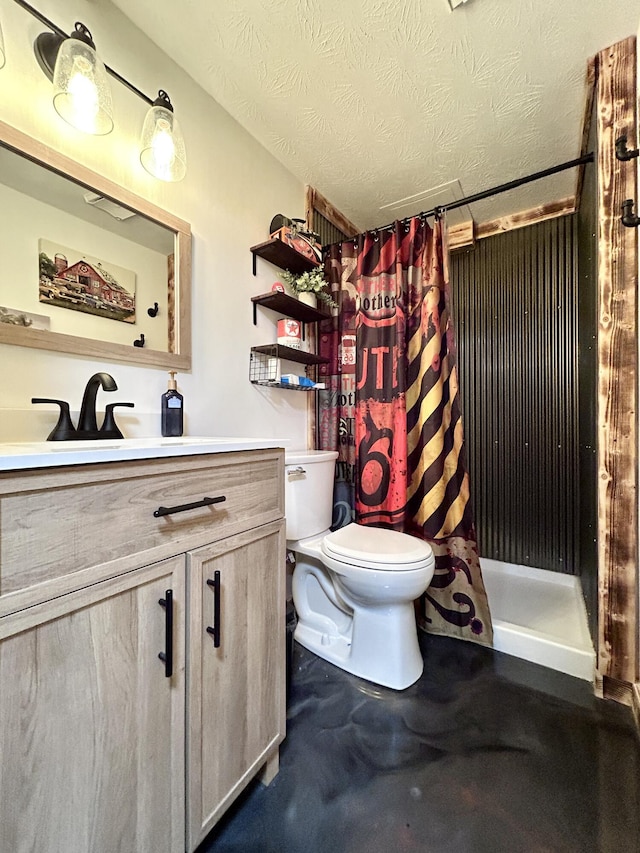 bathroom with curtained shower, toilet, vanity, a textured ceiling, and concrete floors