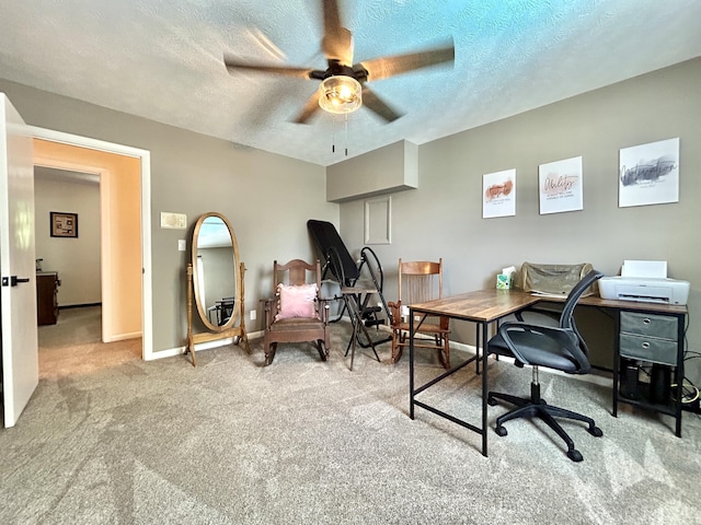 office area with carpet flooring, ceiling fan, a textured ceiling, and baseboards