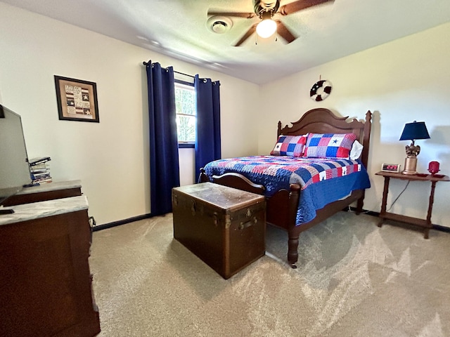 bedroom with a ceiling fan, light colored carpet, visible vents, and baseboards