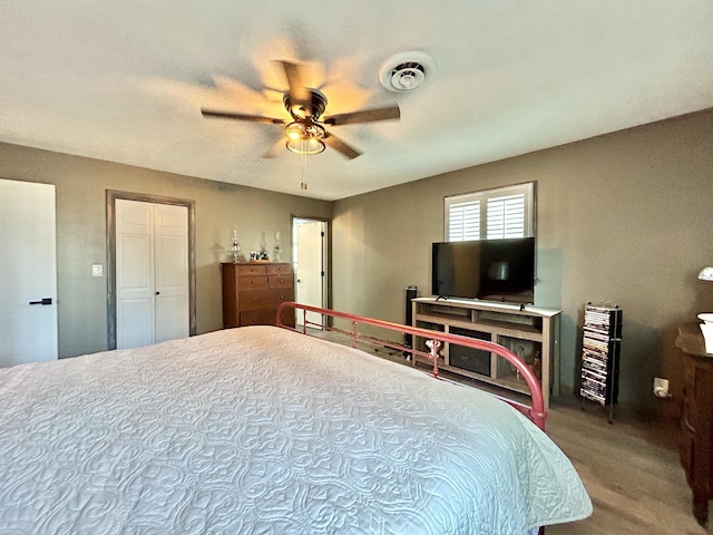 bedroom featuring visible vents and ceiling fan