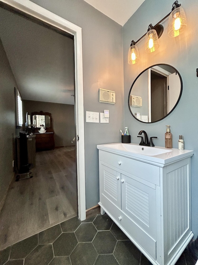 bathroom featuring vanity and wood finished floors