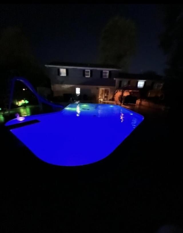 view of pool at night