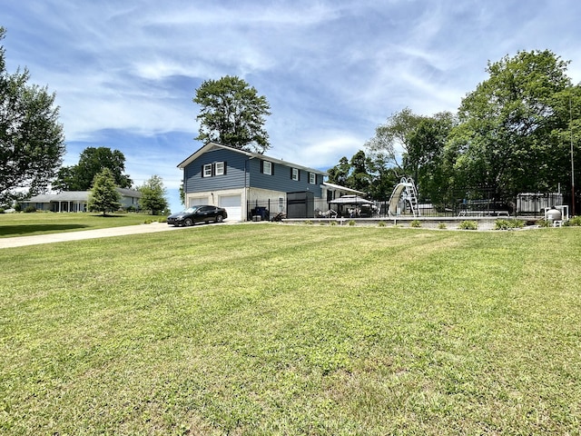 view of yard with a garage and fence