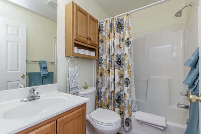 full bath featuring toilet, visible vents, shower / bath combo with shower curtain, and vanity