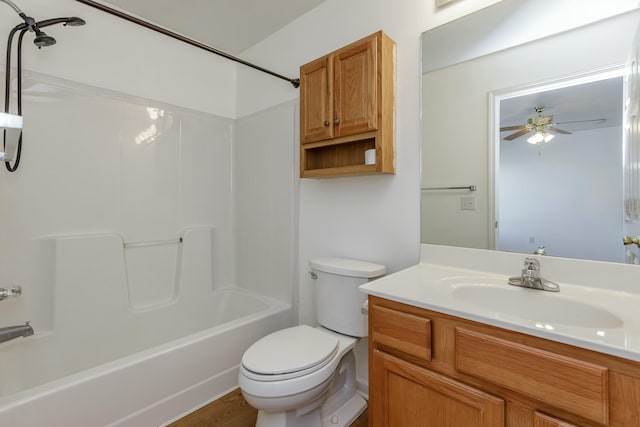 bathroom with toilet, ceiling fan, vanity, and bathing tub / shower combination