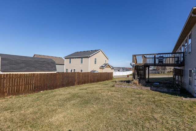 view of yard featuring stairs, fence, and a deck