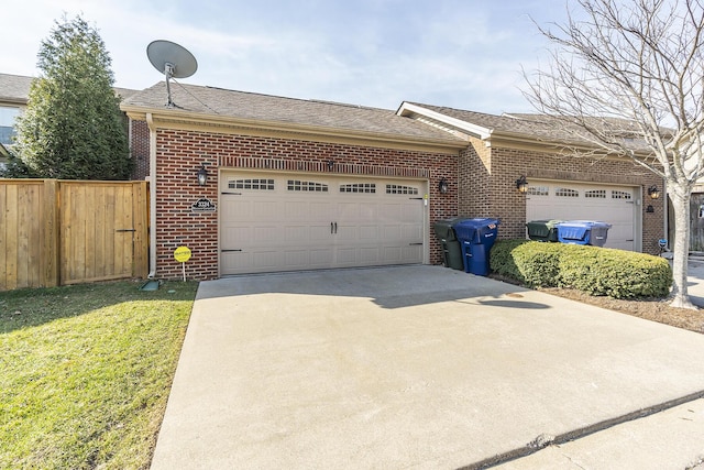 ranch-style home featuring brick siding, fence, concrete driveway, roof with shingles, and an attached garage