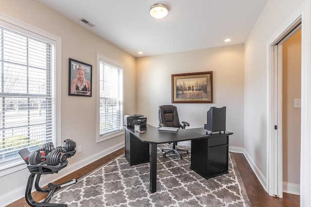 office space featuring dark wood-style floors, recessed lighting, baseboards, and visible vents