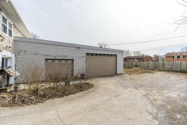 detached garage with fence