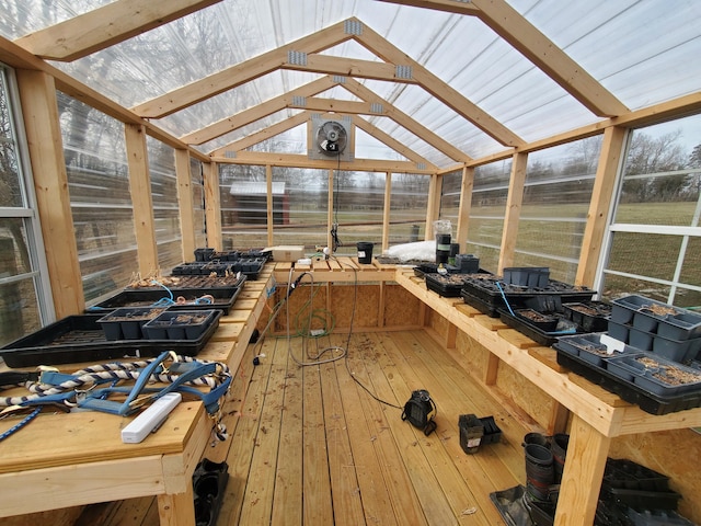 unfurnished sunroom featuring lofted ceiling