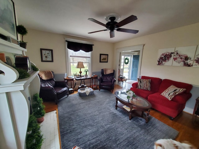 living area featuring wood finished floors and a ceiling fan