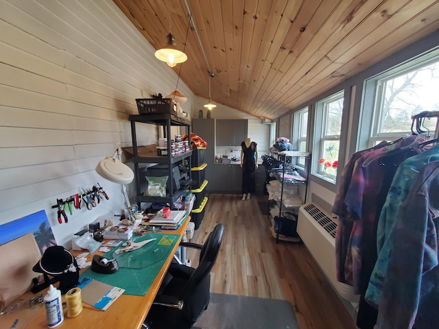 home office with lofted ceiling, wood ceiling, wood finished floors, and an AC wall unit