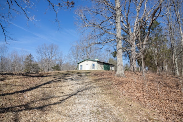 view of side of home featuring a chimney