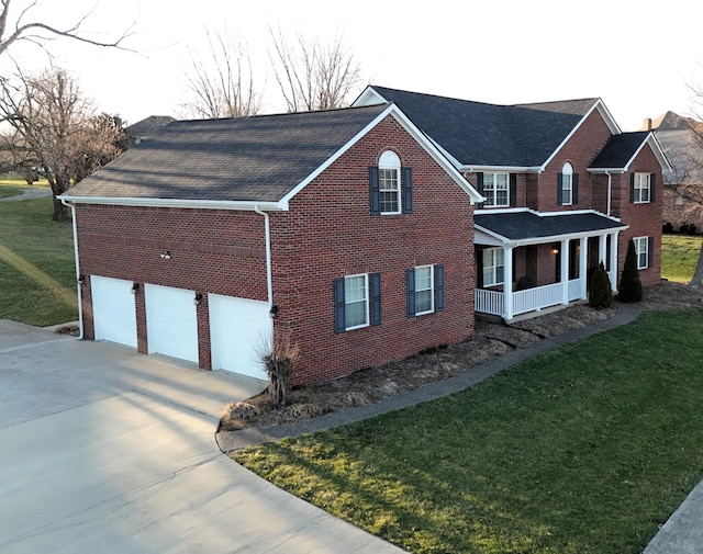 415 David Ln, Winchester, KY 40391 - view of home's exterior with brick siding, concrete driveway, a yard, and roof with shingles
