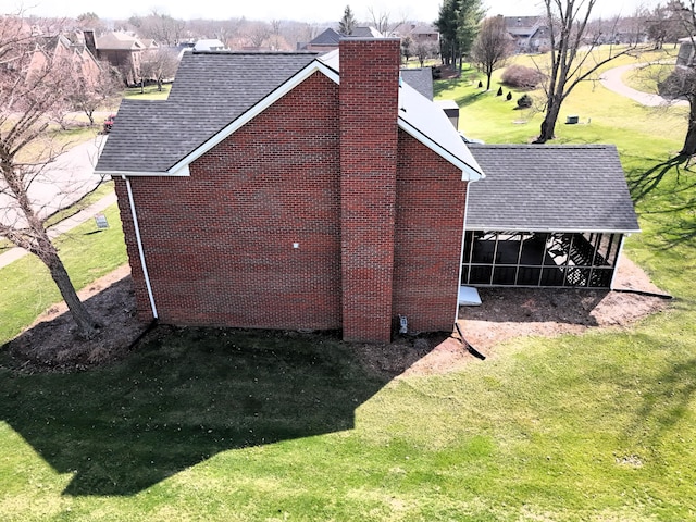 415 David Ln, Winchester, KY 40391 - view of property exterior featuring a shingled roof, a chimney, a yard, and brick siding